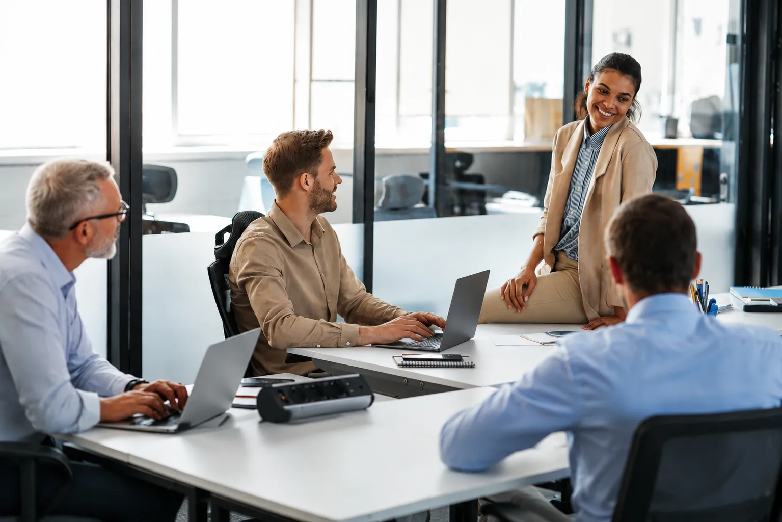 Strategists reviewing a growth plan around a table